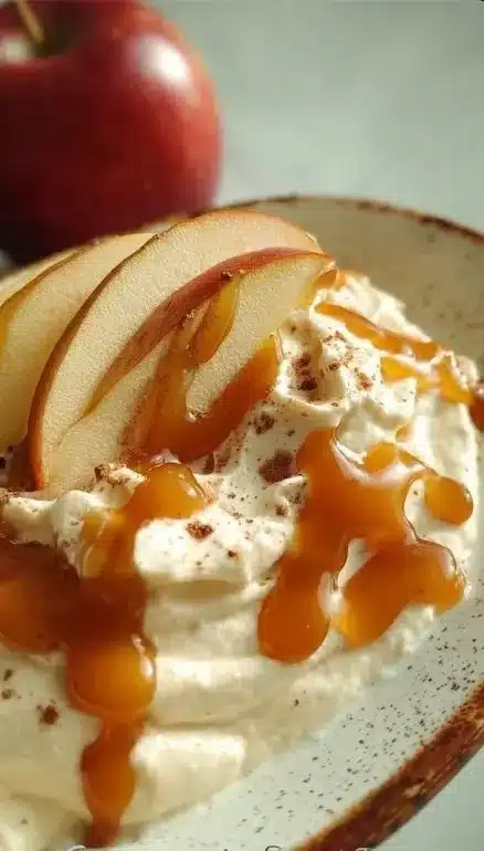 Caramel Apple Dip 1 Creamy caramel apple dip served with fresh apple slices.