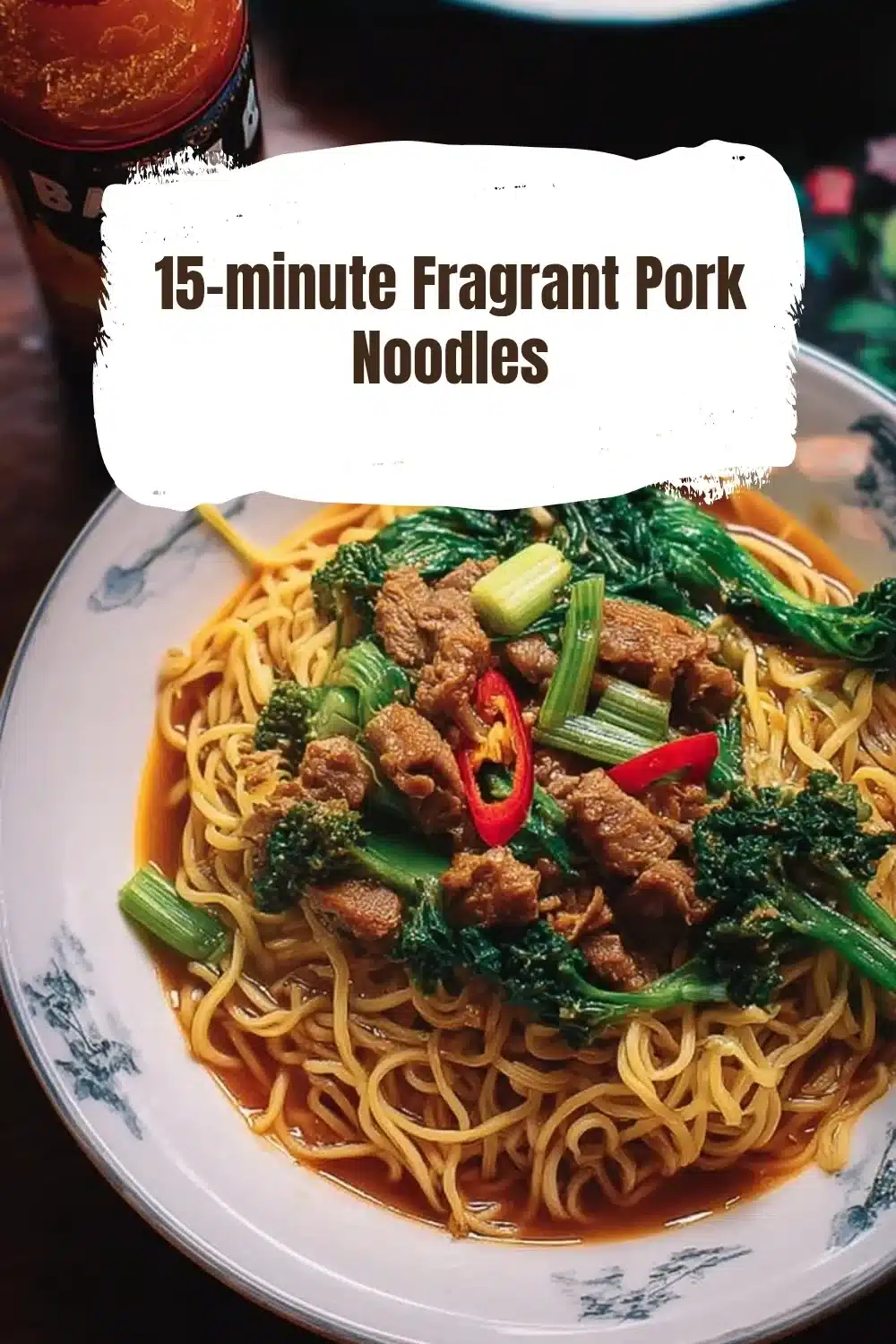 Plate of 15-minute Fragrant Pork Noodles garnished with herbs