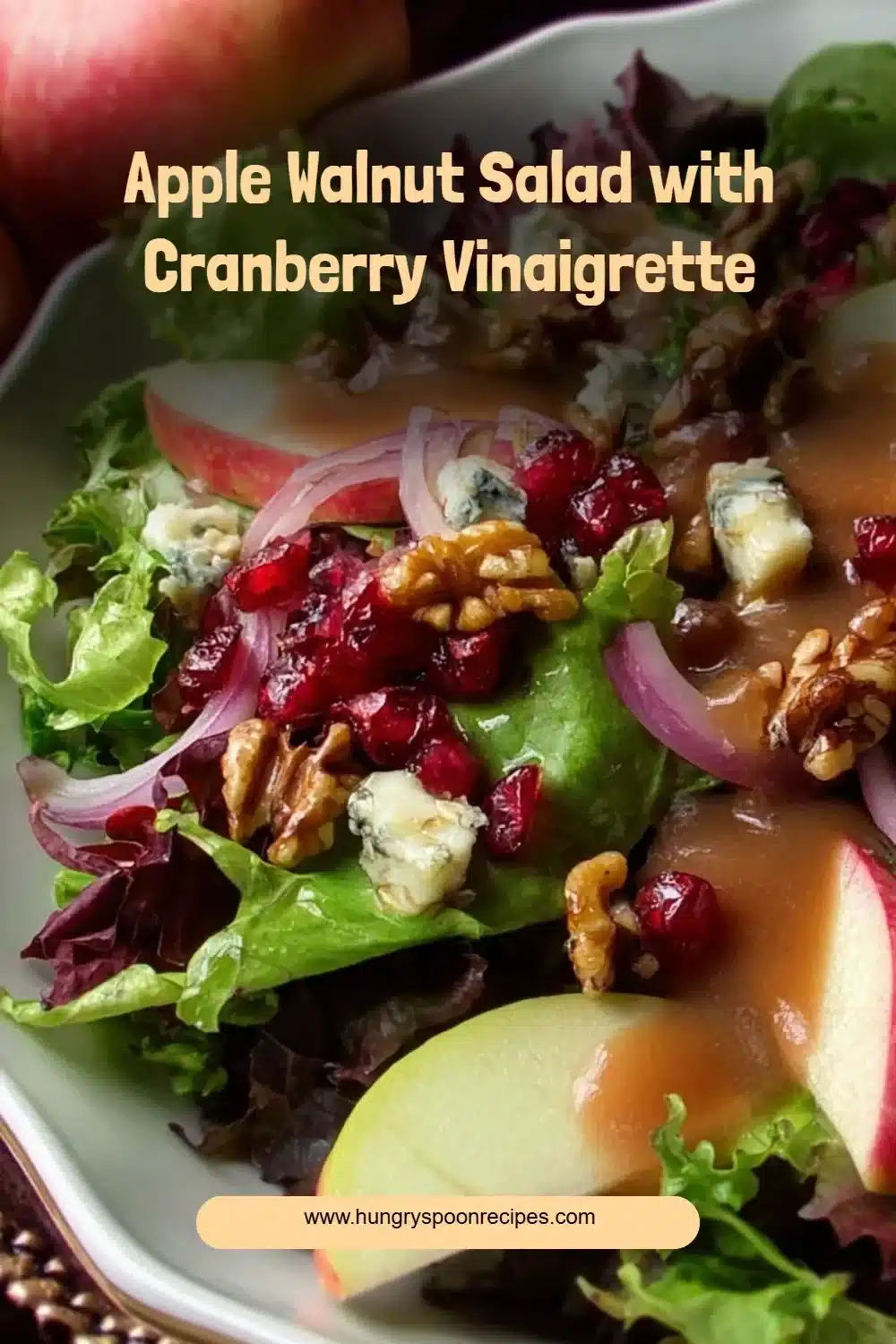 Apple Walnut Salad with Cranberry Vinaigrette 1 Apple Walnut Salad topped with Cranberry Vinaigrette and fresh ingredients.