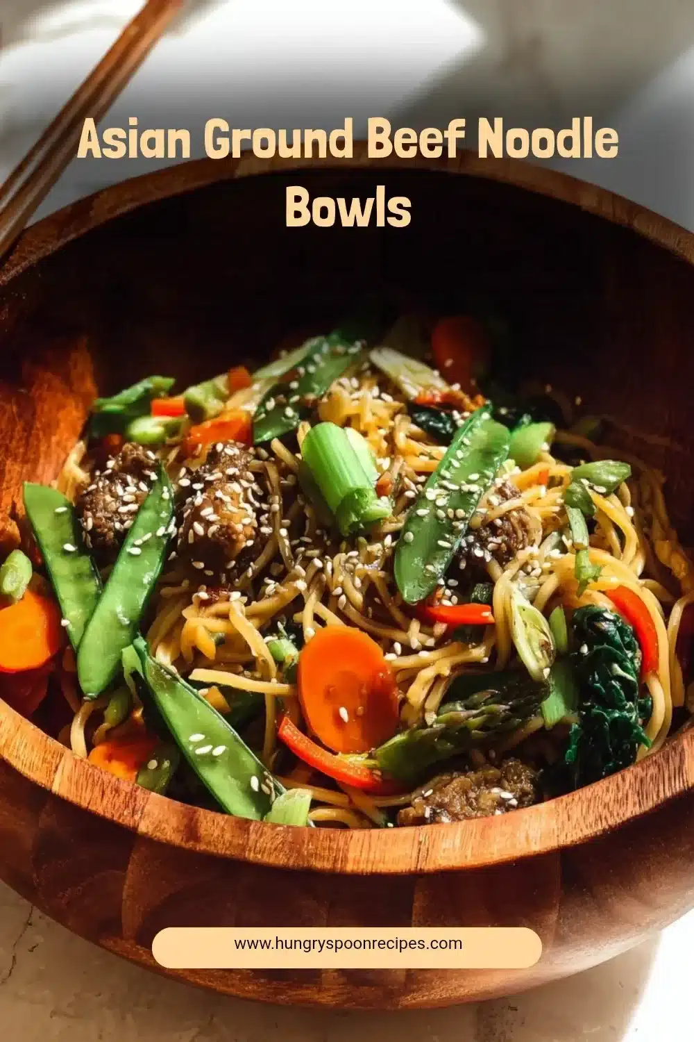 Asian ground beef noodle bowls with vibrant vegetables and noodles