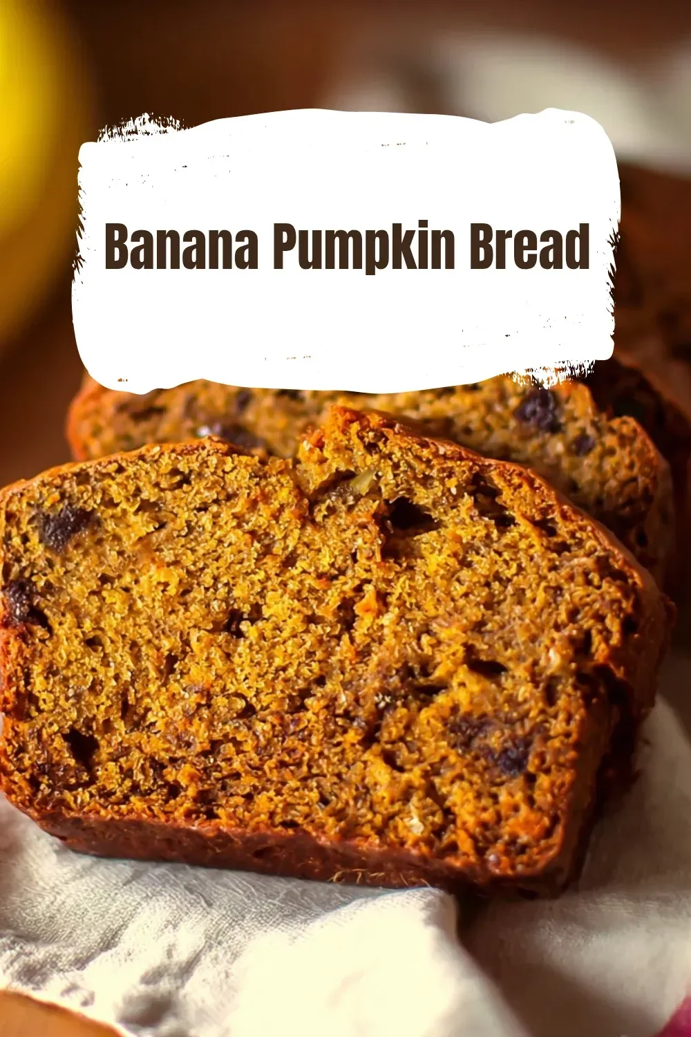 Deliciously baked banana pumpkin bread slices on a wooden table