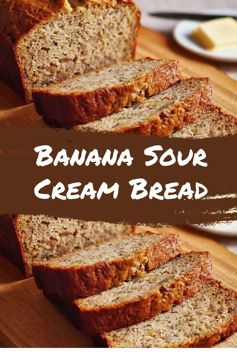 Loaf of banana sour cream bread with sliced bananas on top