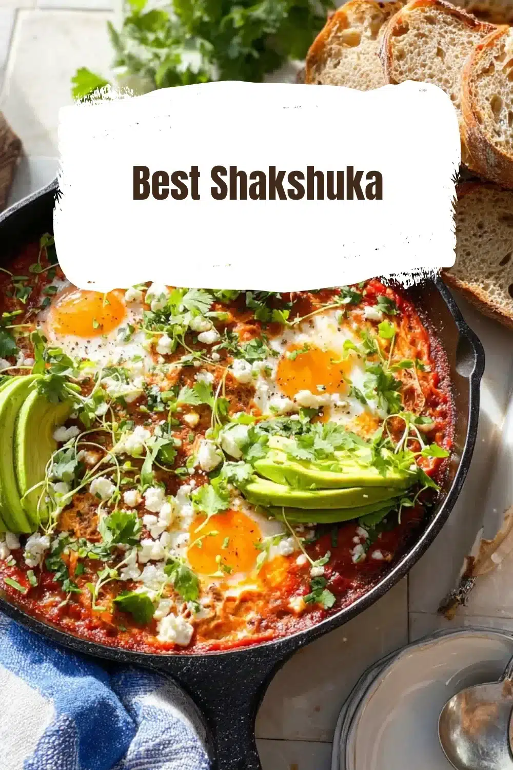 Delicious shakshuka served in a skillet with poached eggs and vibrant tomato sauce.