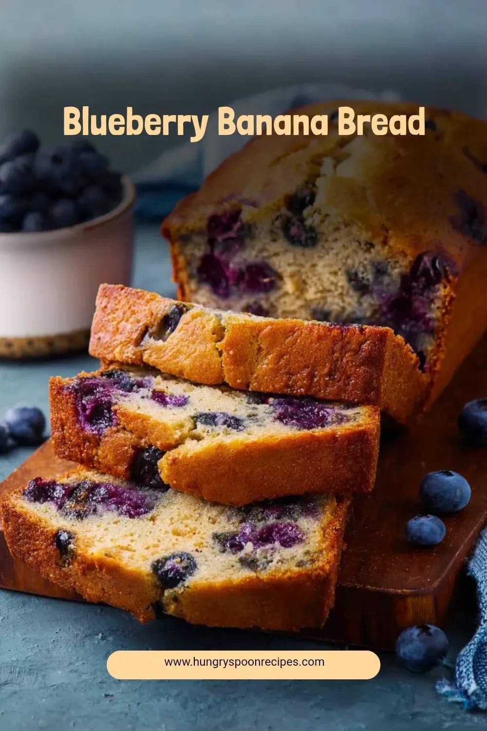 Slice of homemade Blueberry Banana Bread on a wooden cutting board
