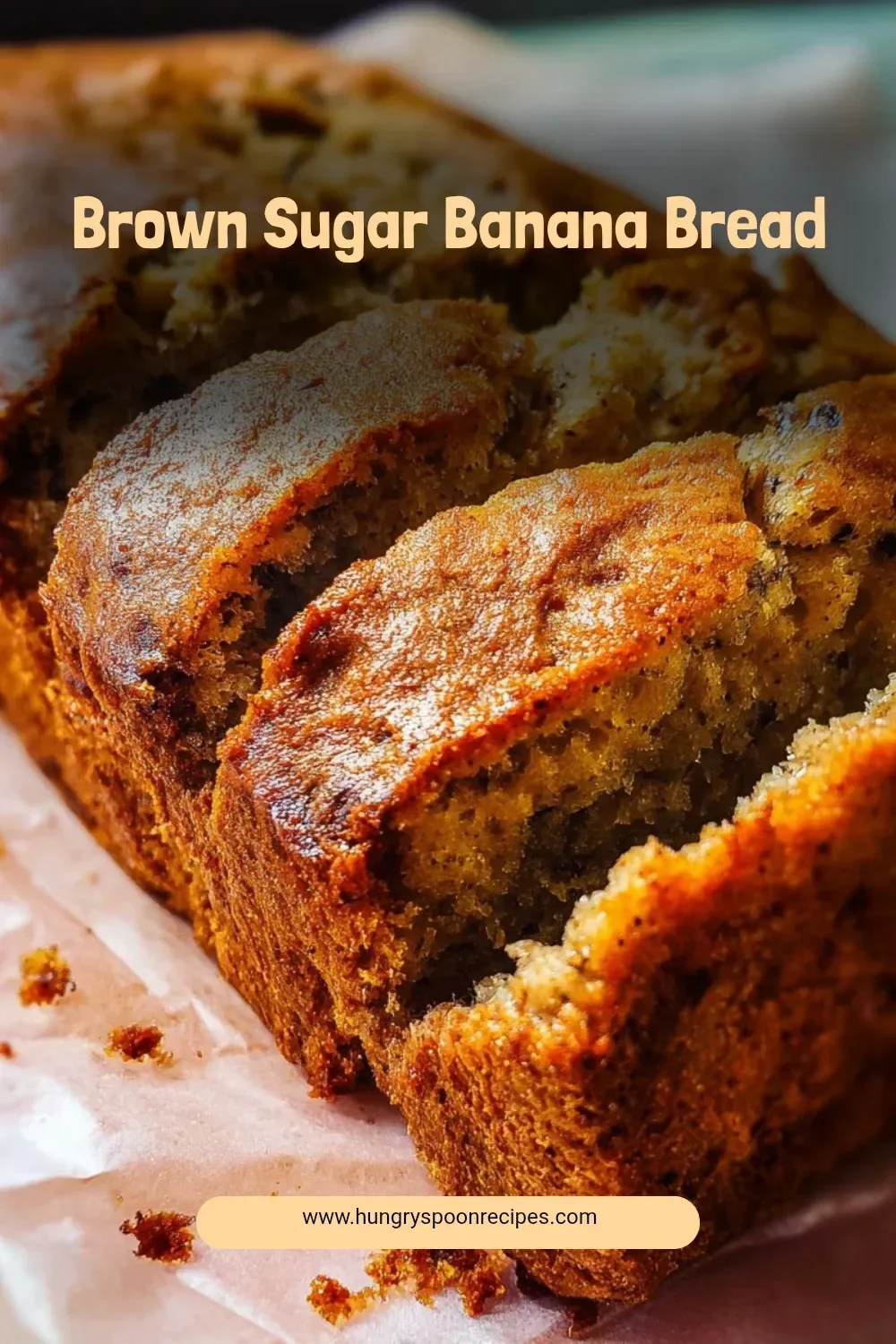 Delicious brown sugar banana bread loaf with sliced bananas on top.