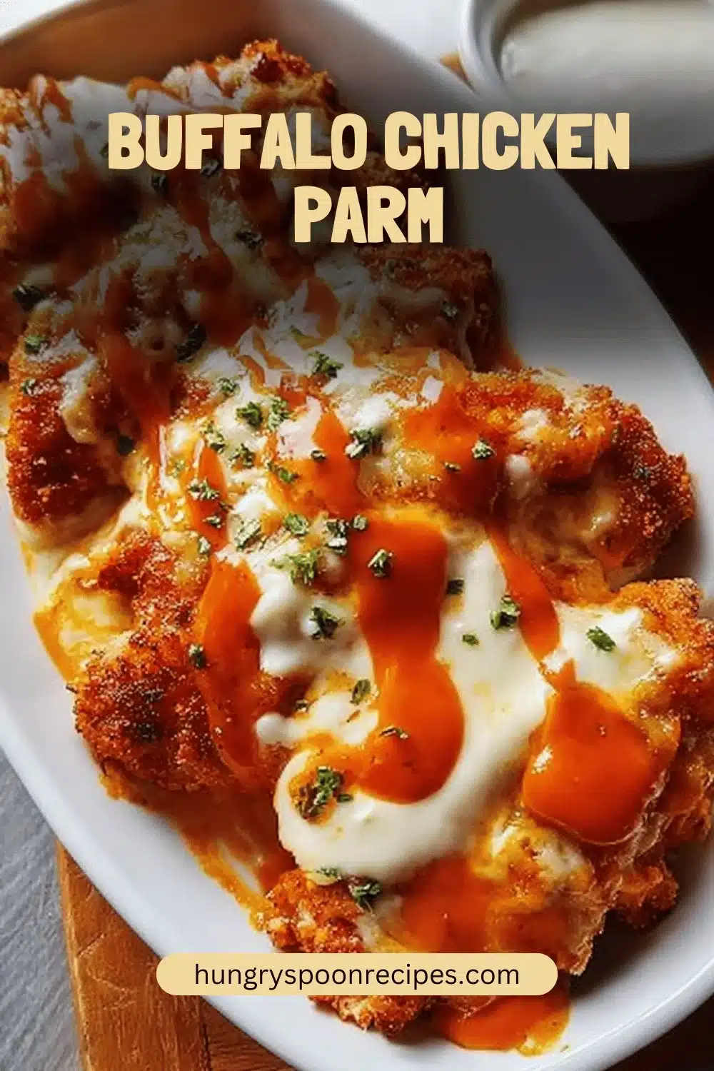 Buffalo Chicken Parm 1 Delicious Buffalo Chicken Parm topped with melted cheese and spicy sauce