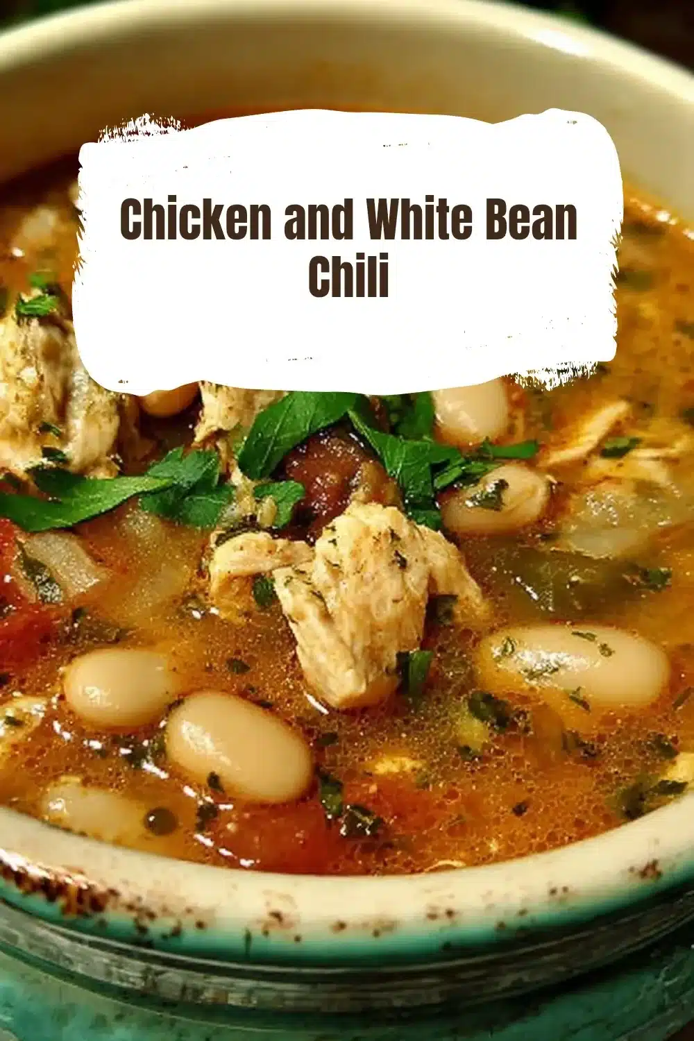 Chicken and White Bean Chili 1 Bowl of Chicken and White Bean Chili garnished with fresh herbs