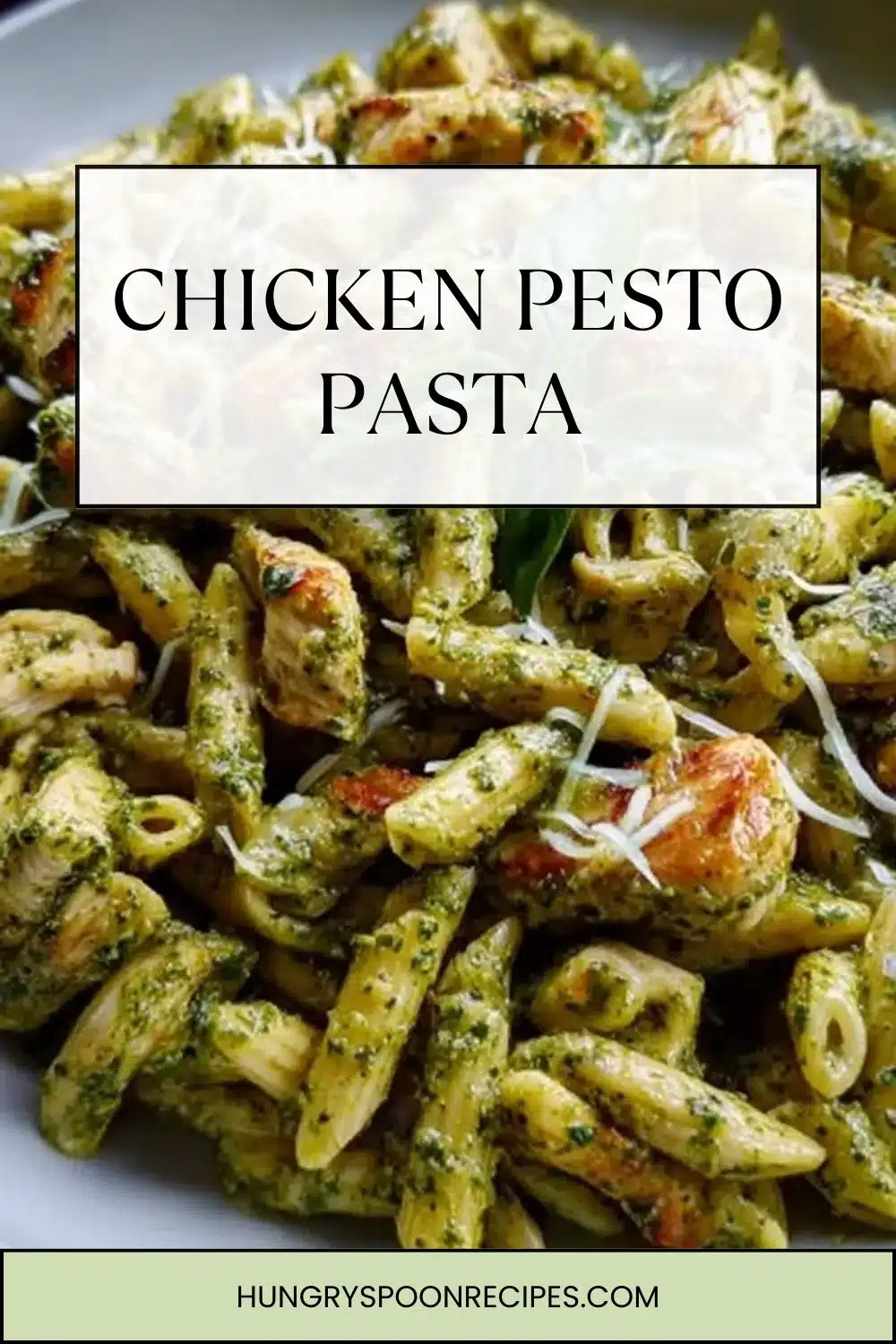 Chicken Pesto Pasta 1 Creamy Chicken Pesto Pasta garnished with fresh basil and Parmesan cheese.