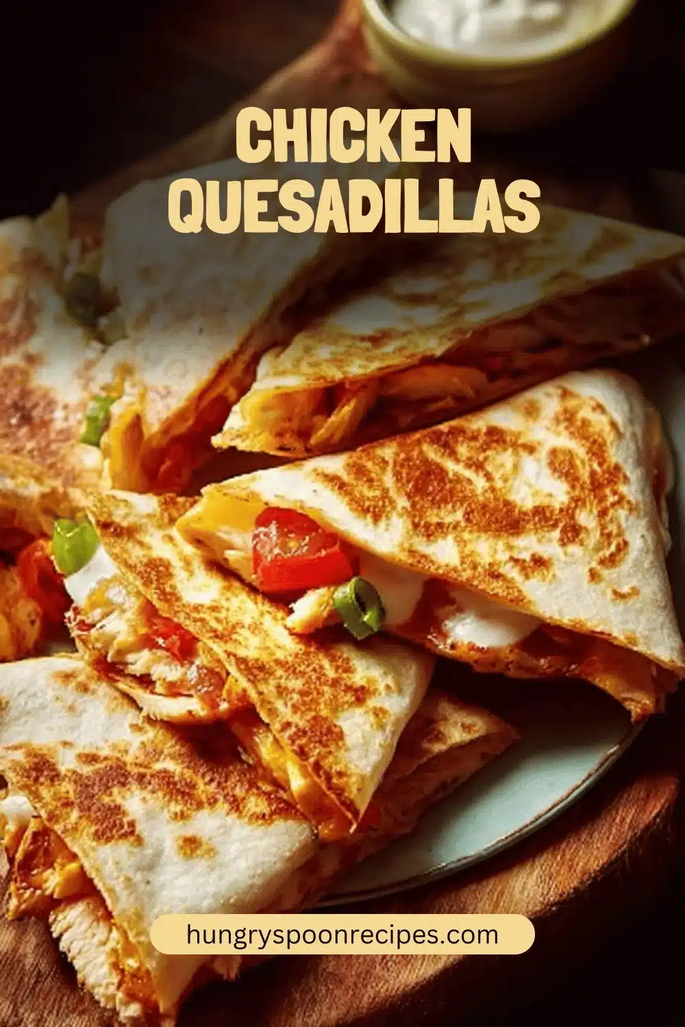 Delicious homemade chicken quesadillas served with salsa and guacamole.