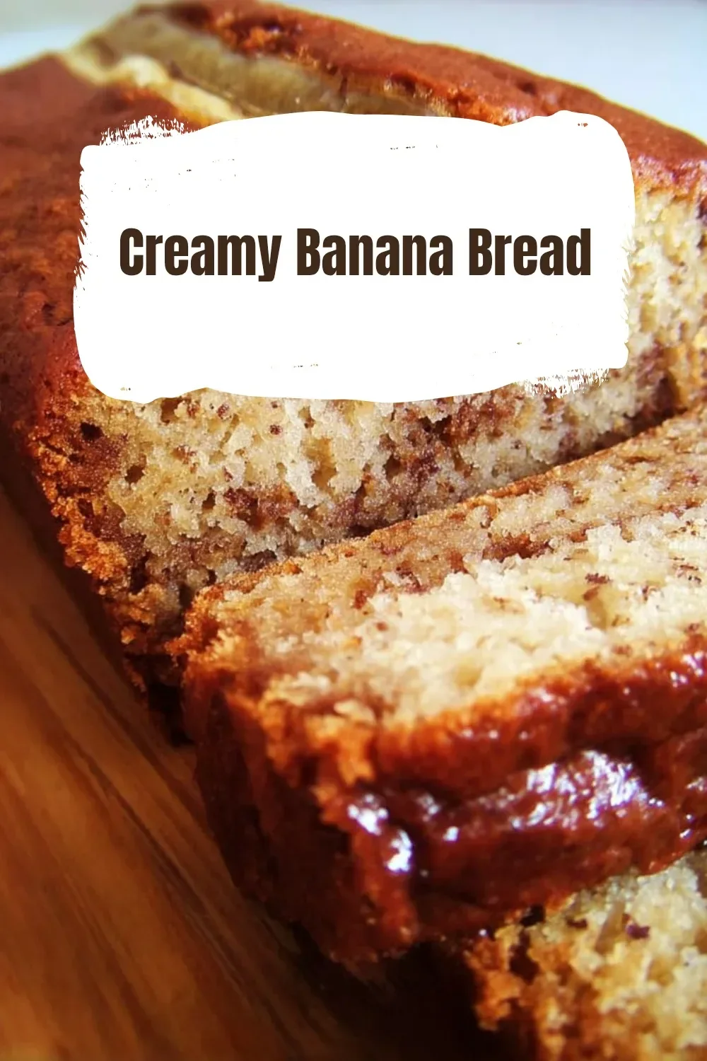 Slice of creamy banana bread with walnuts and banana slices on top