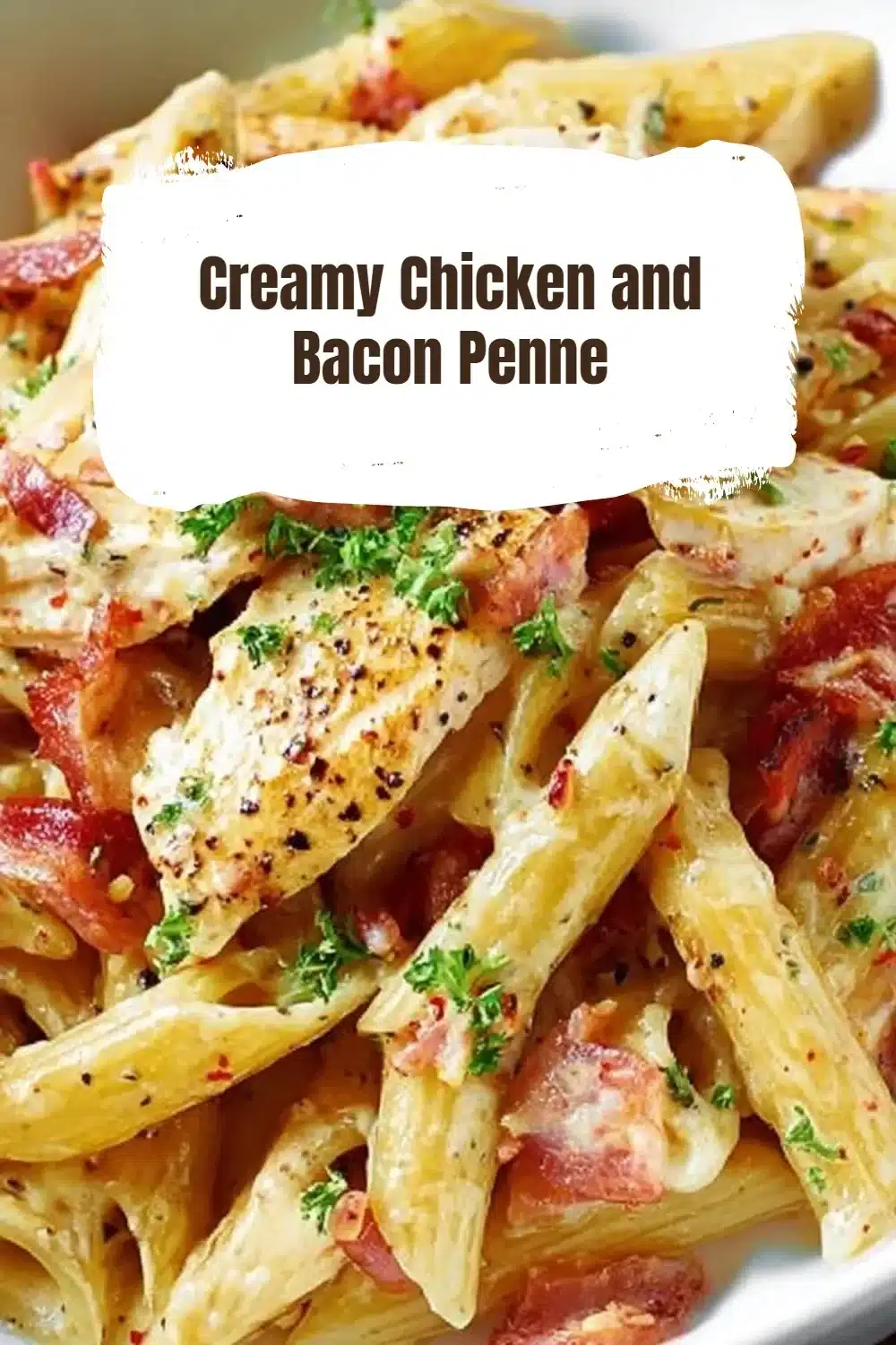 Creamy Chicken and Bacon Penne 1 Creamy Chicken Bacon Penne served in a bowl topped with herbs