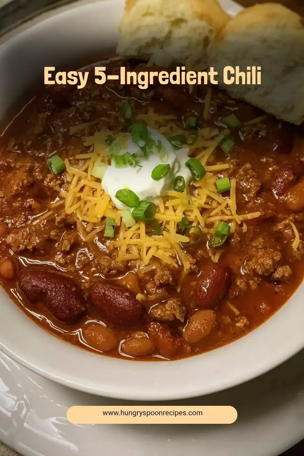 Bowl of easy 5-ingredient chili topped with cheese and cilantro