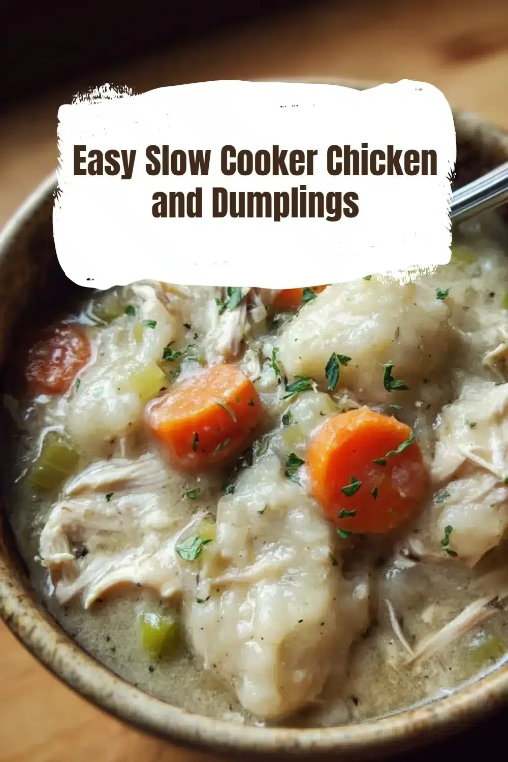 Bowl of easy slow cooker chicken and dumplings topped with herbs