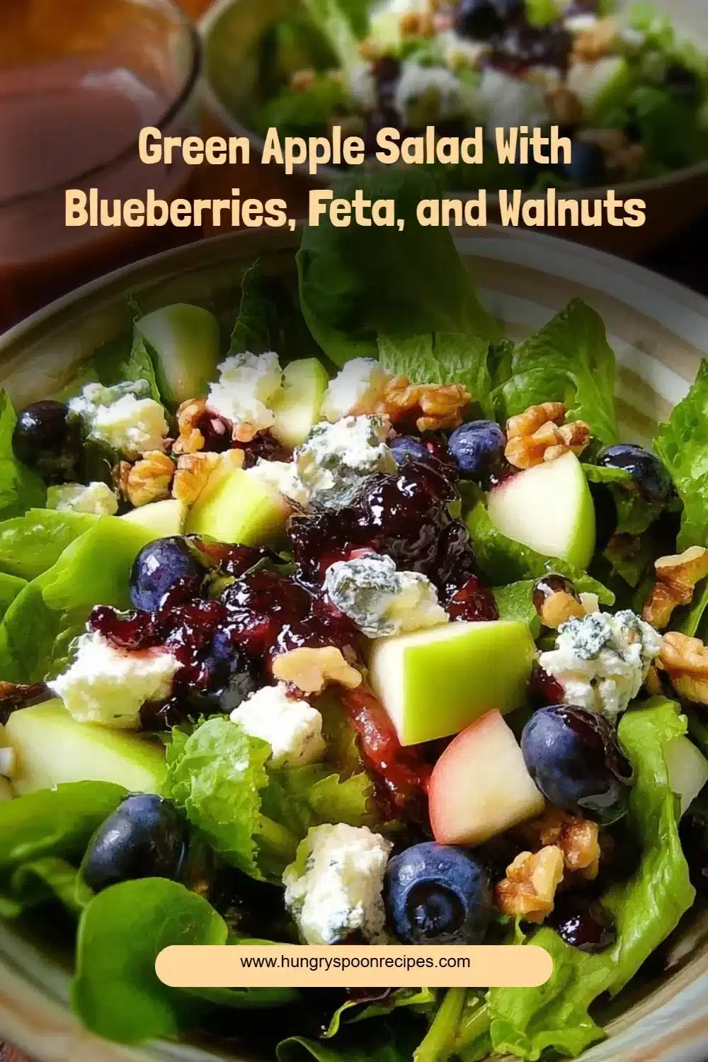 Green Apple Salad with blueberries, feta cheese, and walnuts in a bowl.