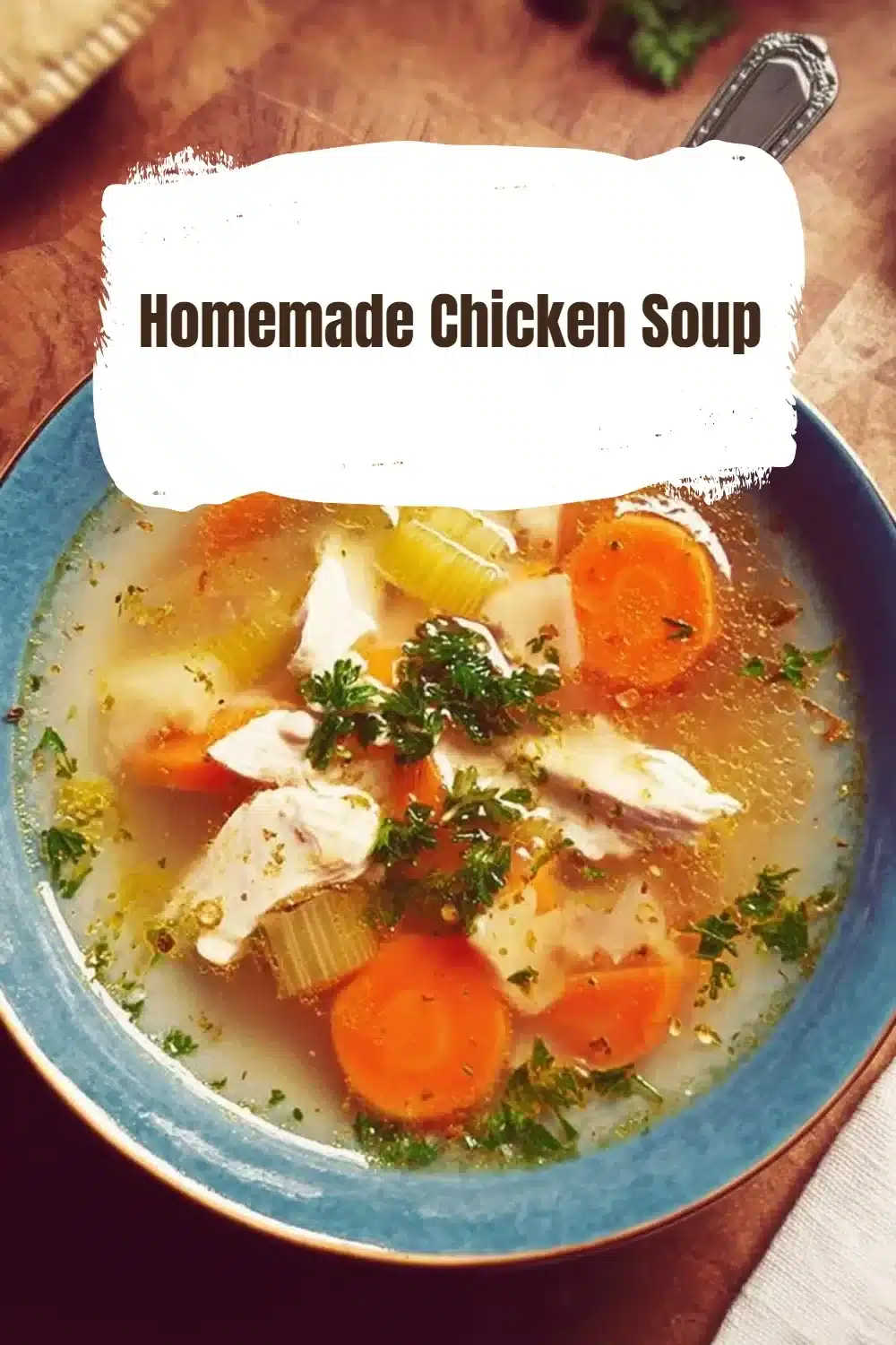 Bowl of homemade chicken soup with vegetables and herbs
