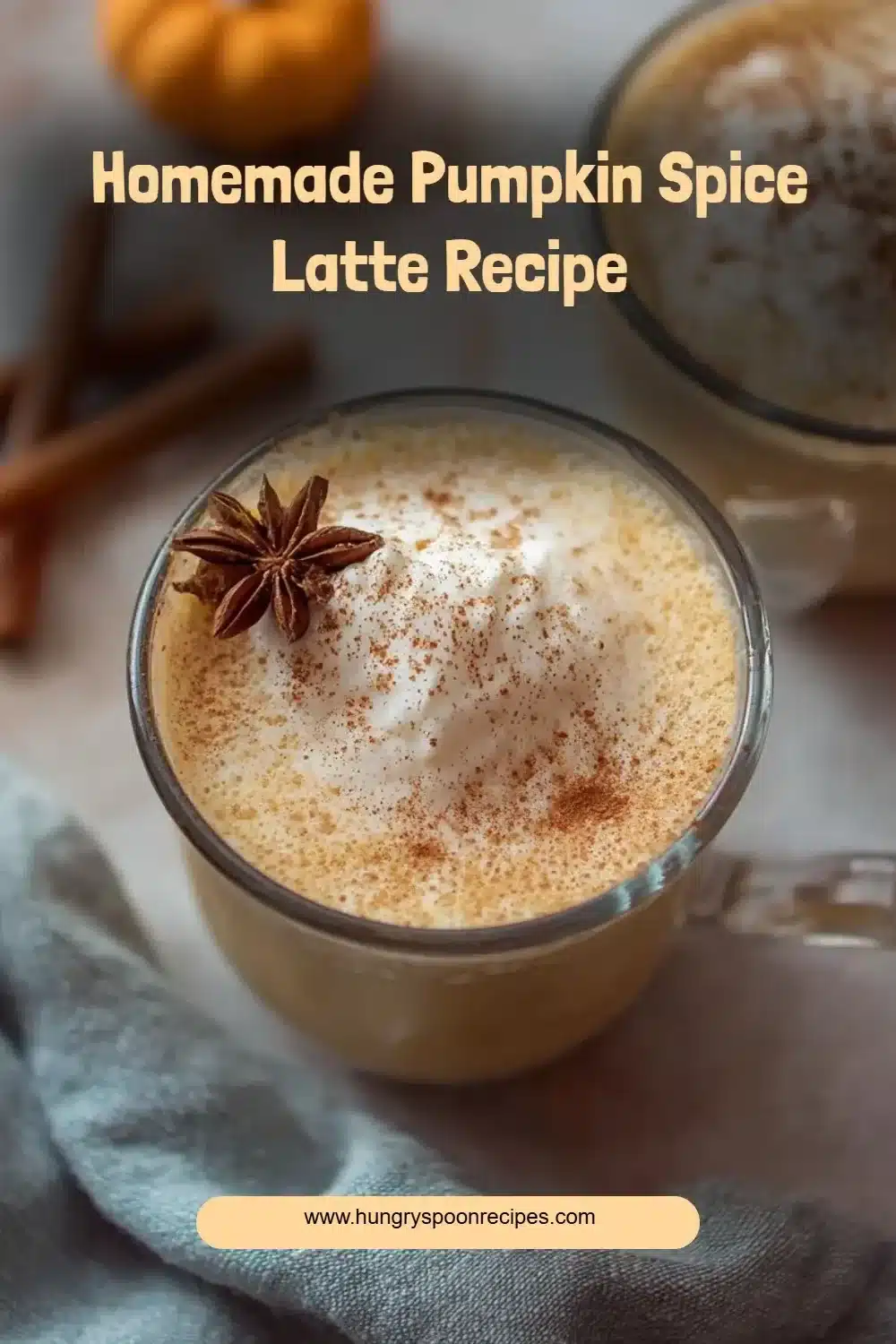 A warm homemade pumpkin spice latte topped with whipped cream and cinnamon