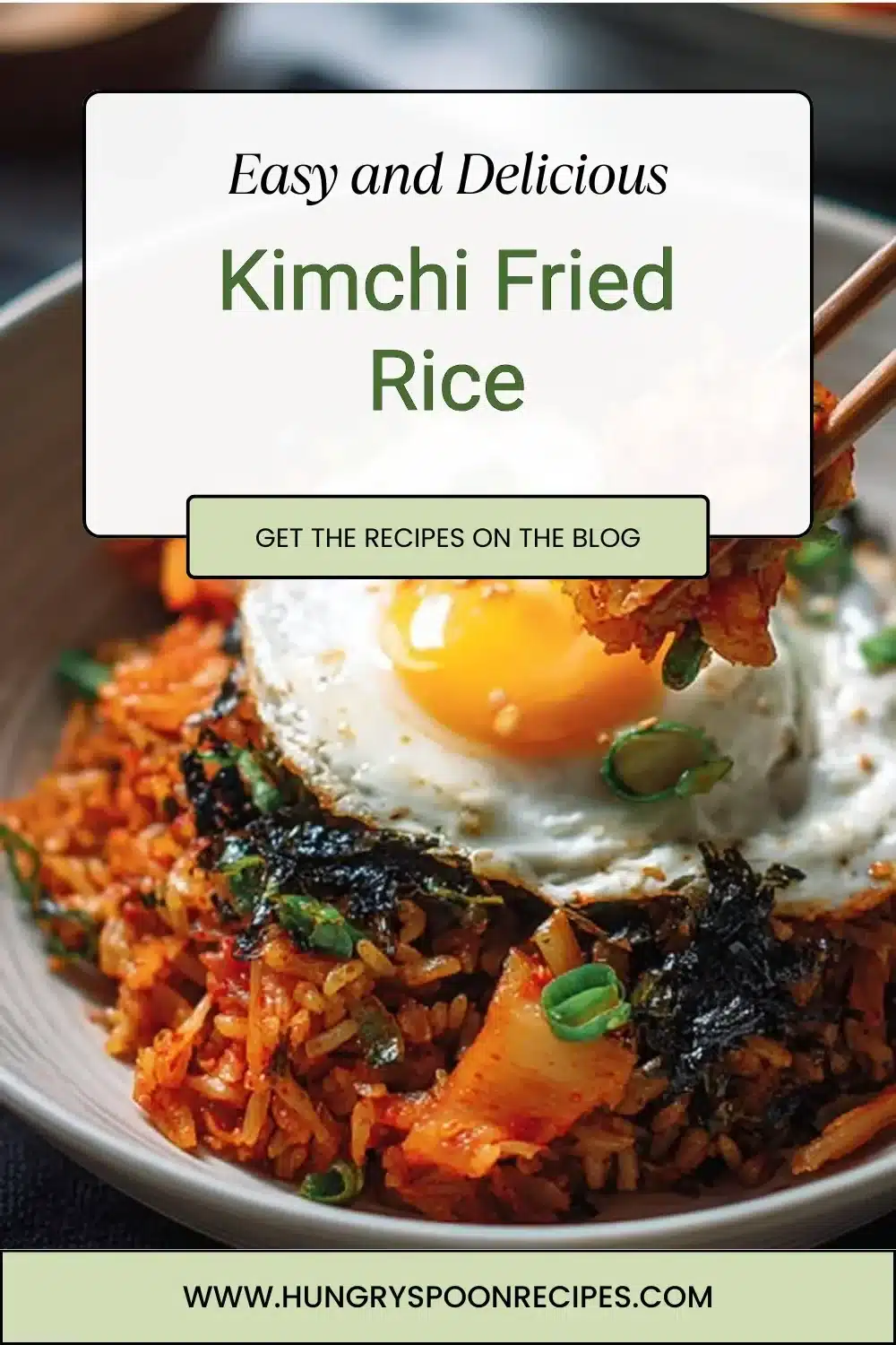 Kimchi Fried Rice 1 A vibrant bowl of kimchi fried rice topped with green onions and sesame seeds.