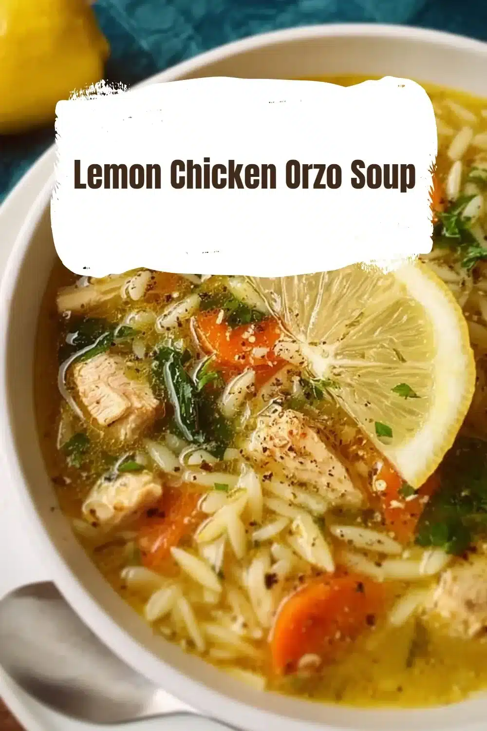 Bowl of Lemon Chicken Orzo Soup with fresh herbs garnish