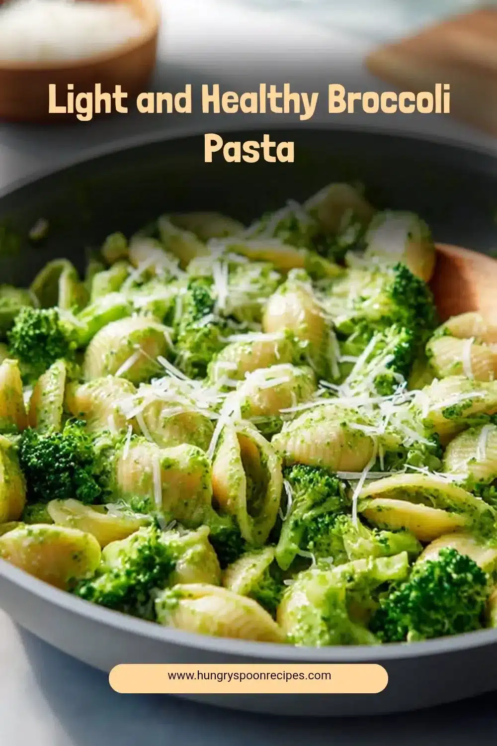 Plate of light and healthy broccoli pasta garnished with herbs and cheese