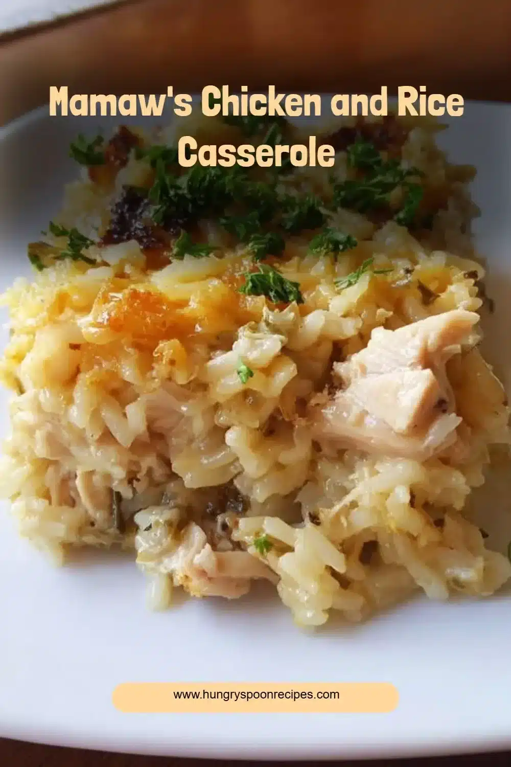 Mamaw's Chicken and Rice Casserole served in a bowl with herbs garnish