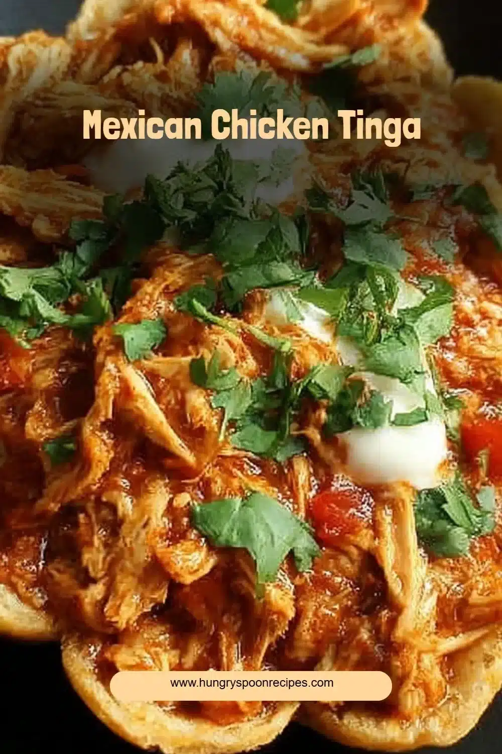 Deliciously spiced Mexican Chicken Tinga served in tacos with fresh toppings