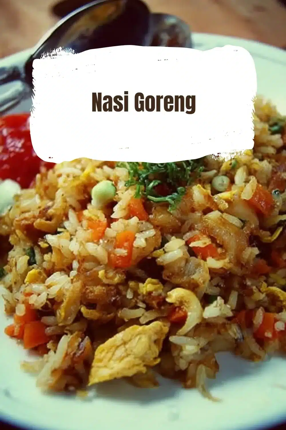 Delicious plate of Nasi Goreng, traditional Indonesian fried rice with vegetables and shrimp.