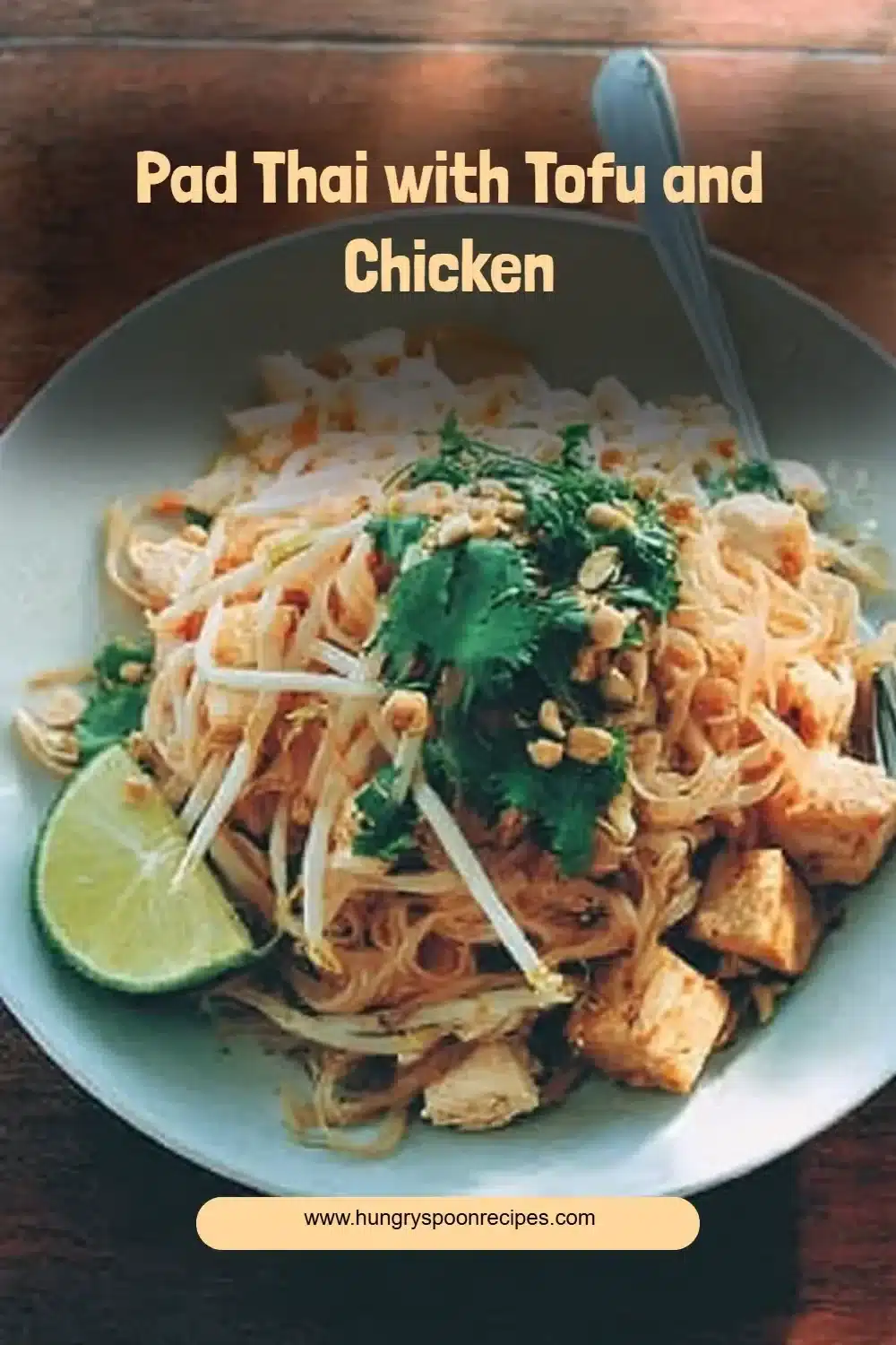 Pad Thai with Tofu and Chicken 1 Plate of Pad Thai with Tofu and Chicken garnished with lime and peanuts