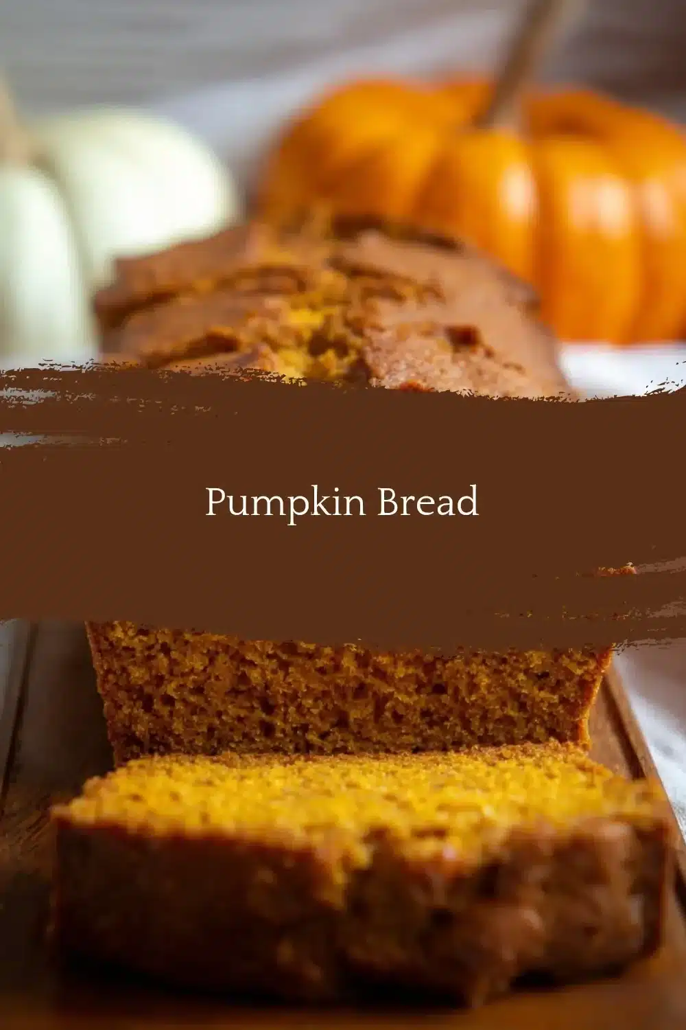 Freshly baked Pumpkin Bread loaf on a wooden cutting board