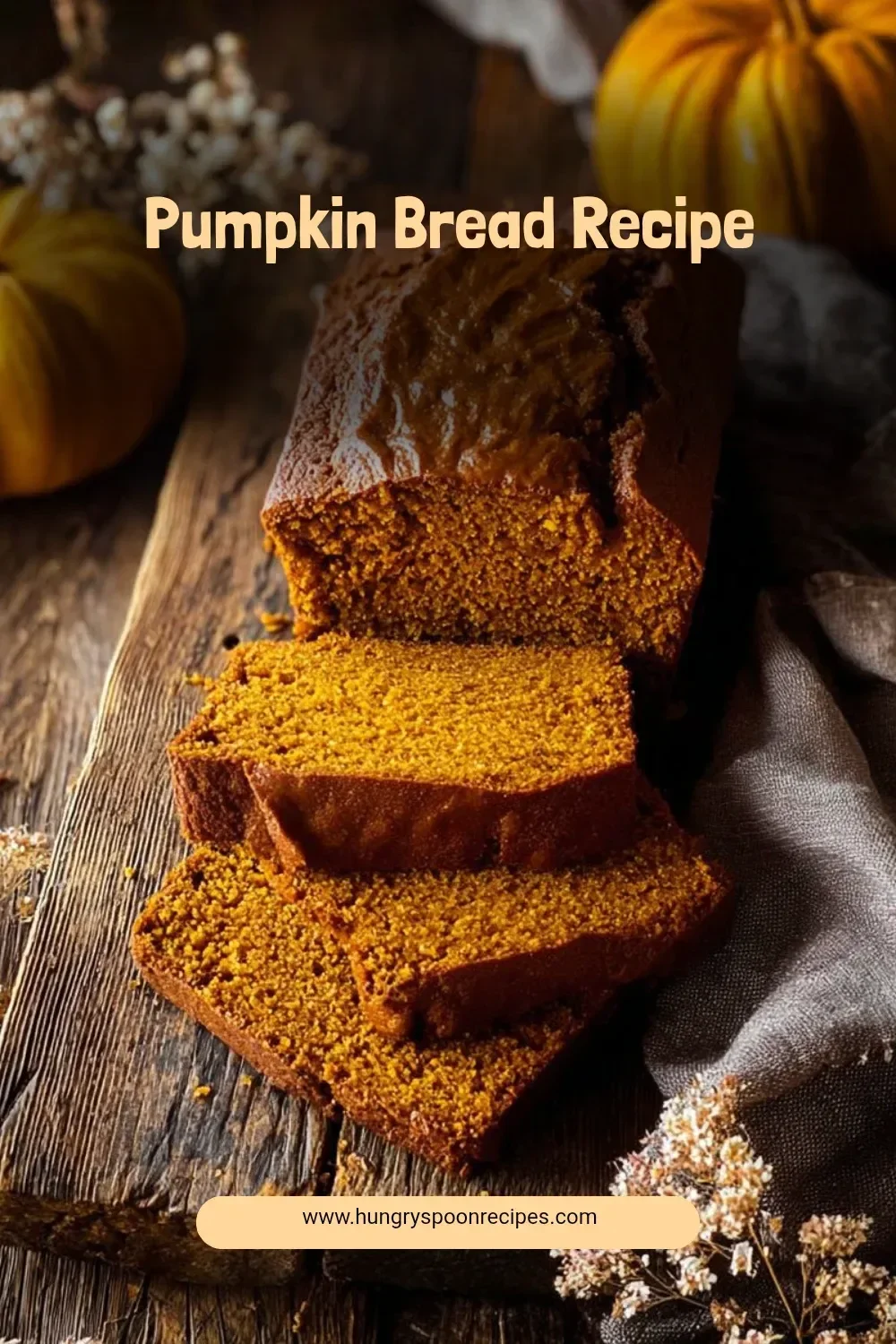 Loaf of homemade pumpkin bread with spices and walnuts on a rustic table