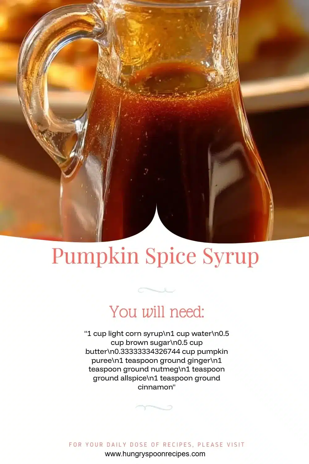 Homemade pumpkin spice syrup in a glass jar with a cinnamon stick and pumpkins.