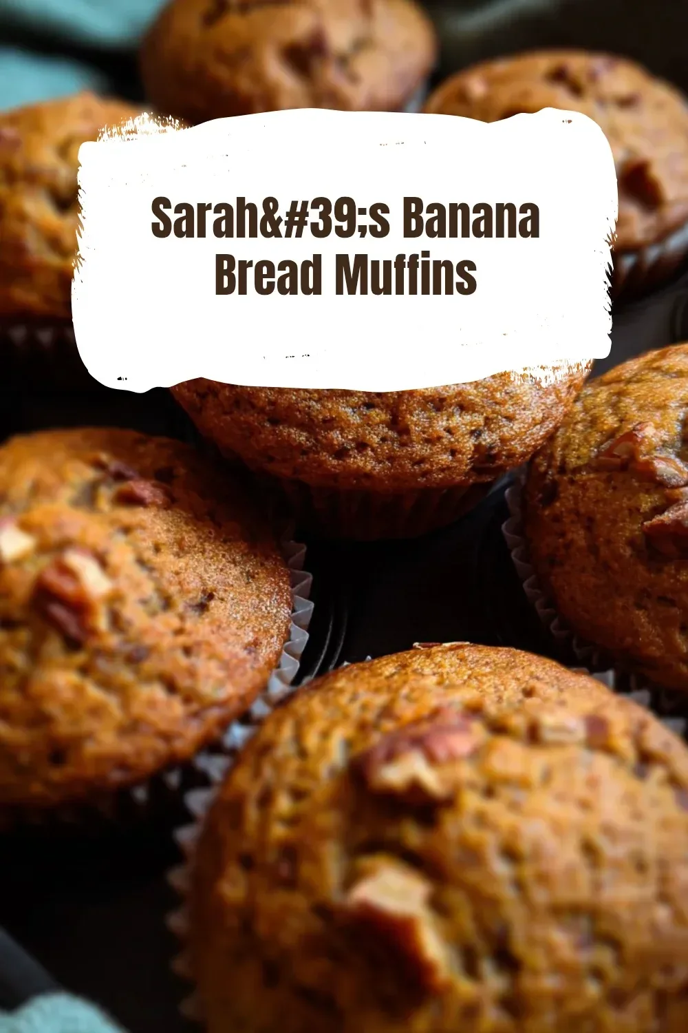 Freshly baked Sarah's banana bread muffins on a cooling rack.