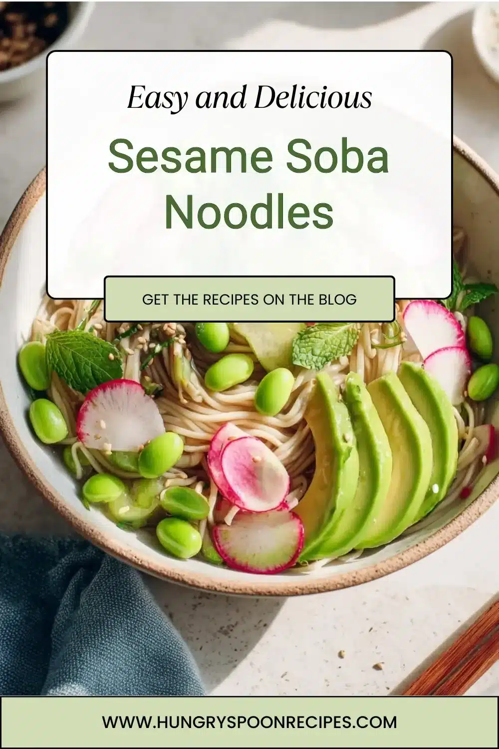 A bowl of sesame soba noodles garnished with sesame seeds and green onions