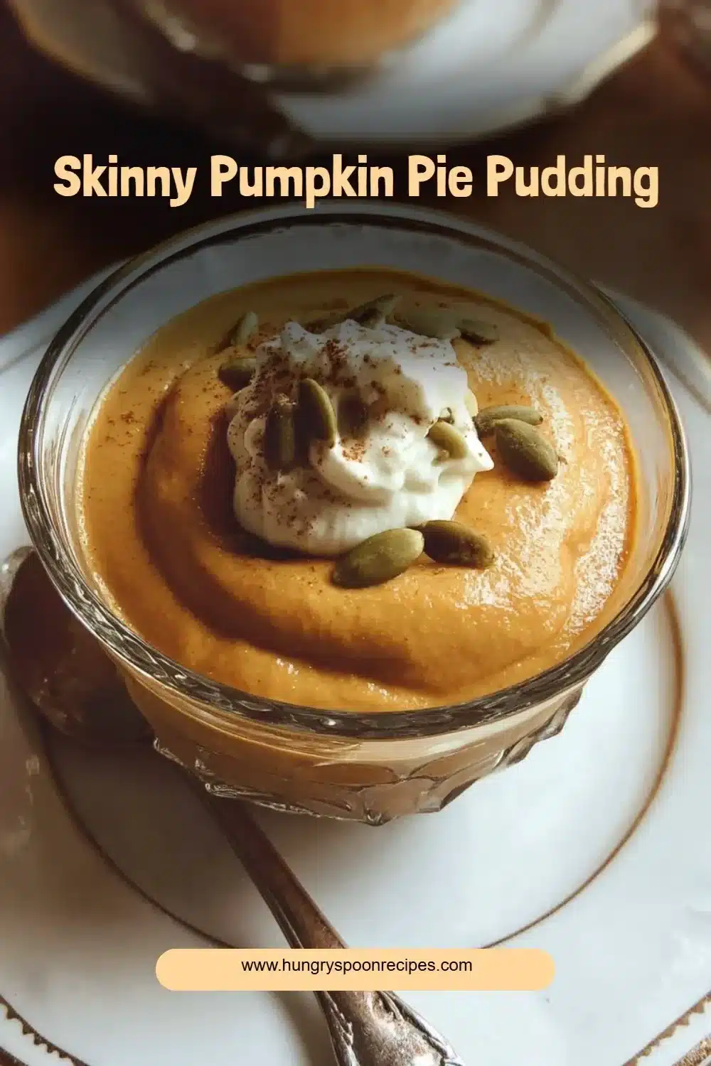 Skinny pumpkin pie pudding dessert served in a bowl with a sprinkle of cinnamon.