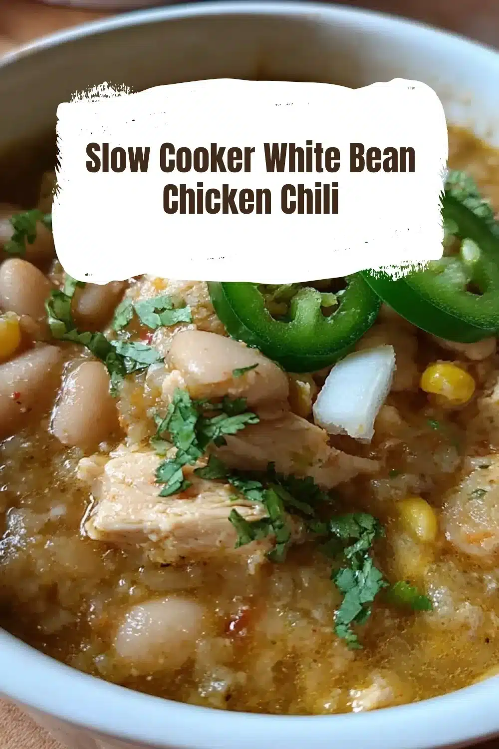 Slow Cooker White Bean Chicken Chili 1 Bowl of slow cooker white bean chicken chili topped with fresh herbs