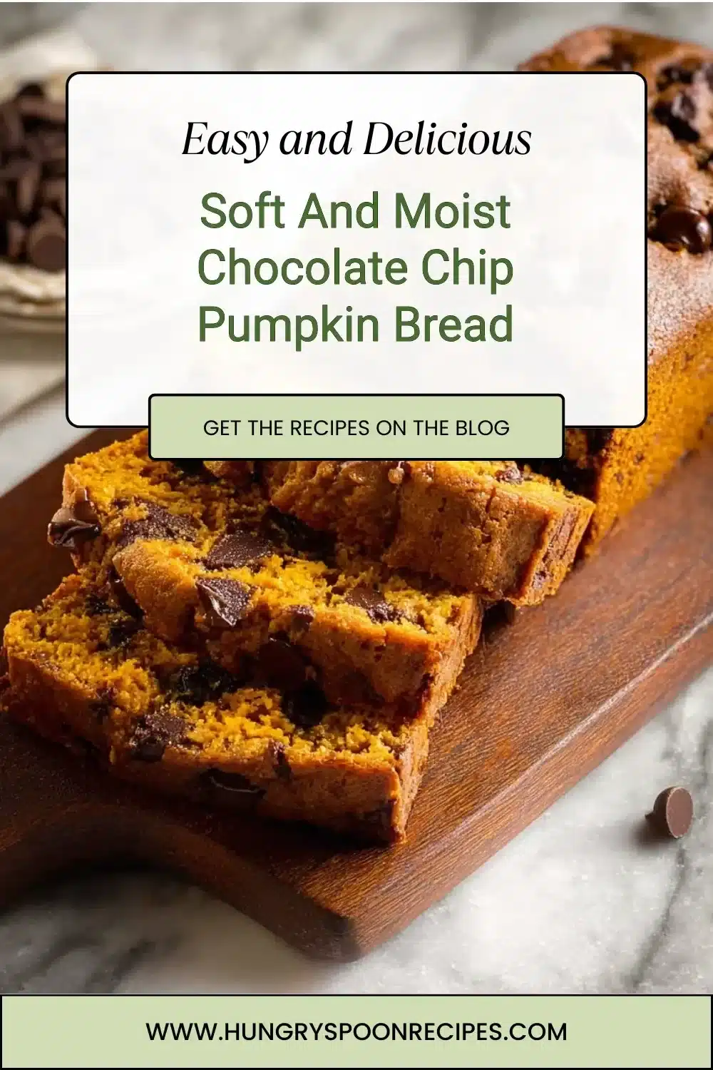 Soft and moist chocolate chip pumpkin bread loaf on a wooden table