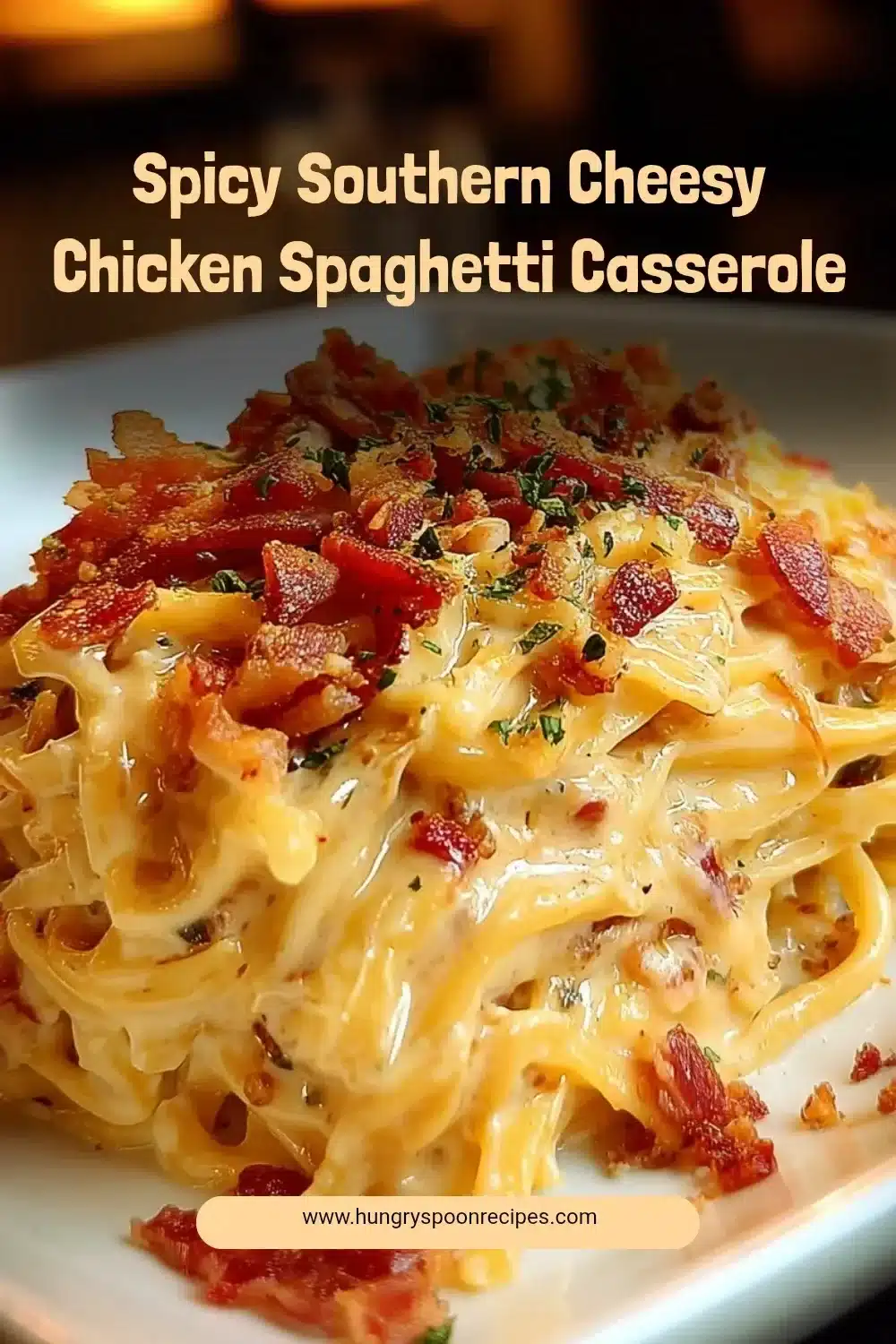 Spicy Southern Cheesy Chicken Spaghetti Casserole topped with cheese and herbs.