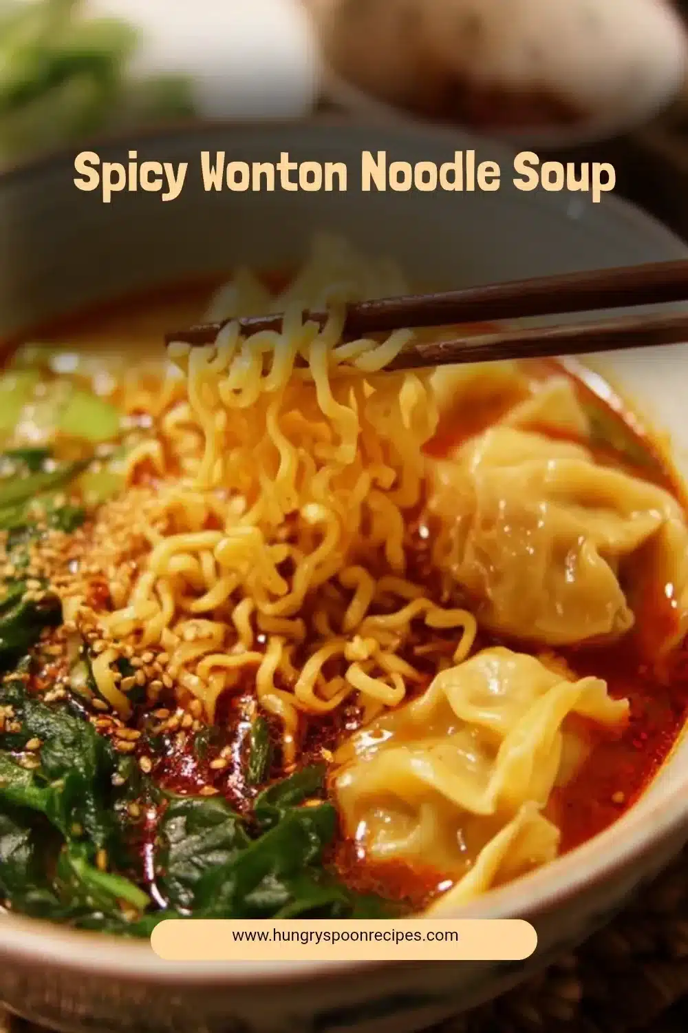 Bowl of spicy wonton noodle soup with vibrant ingredients and steam rising