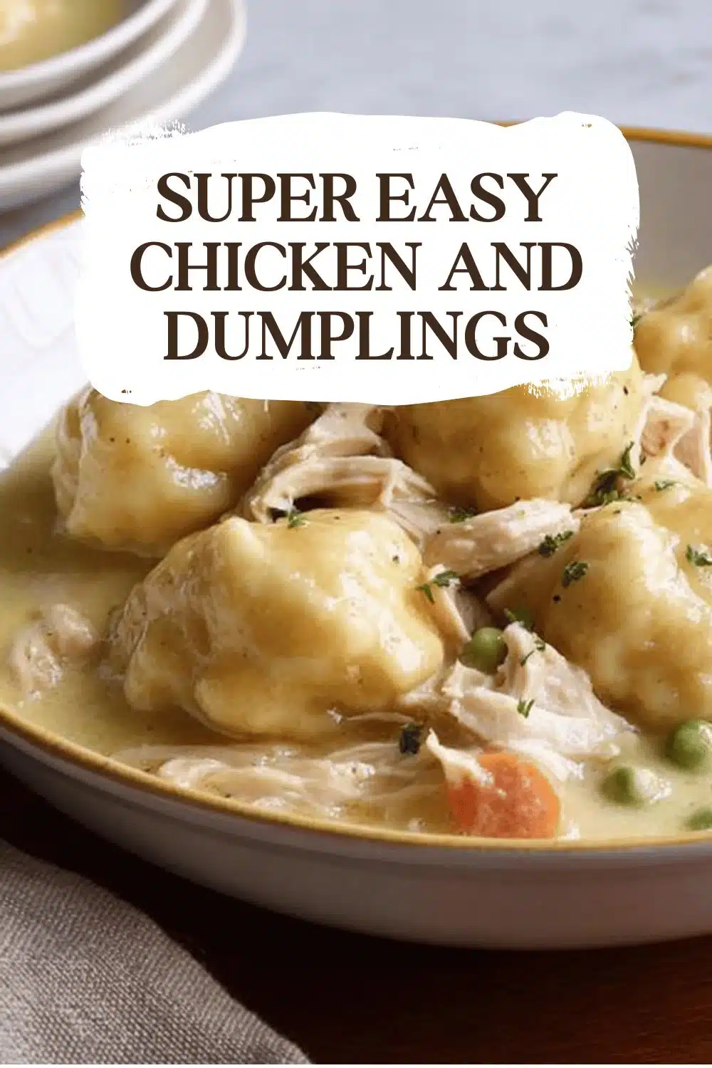 Bowl of super easy chicken and dumplings with herbs and vegetables