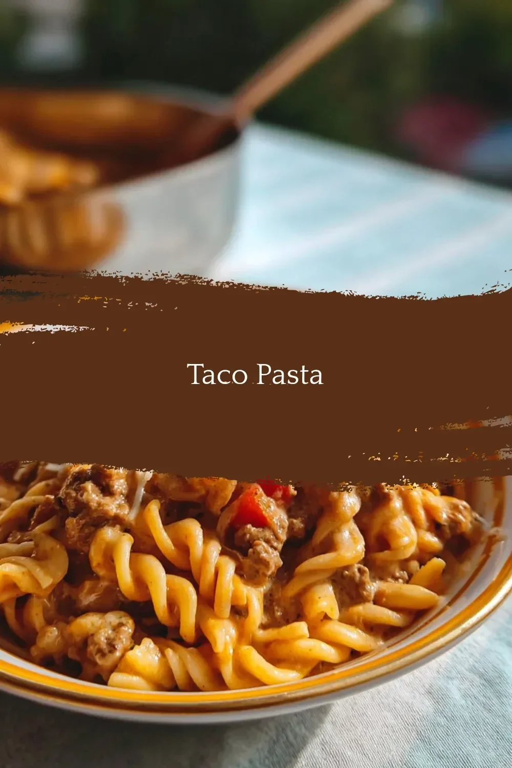 Delicious Taco Pasta dish with ground beef, cheese, and colorful veggies