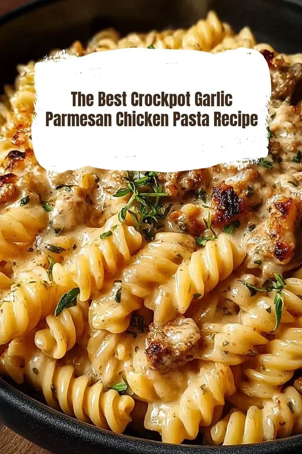 The Best Crockpot Garlic Parmesan Chicken Pasta Recipe 1 Delicious crockpot garlic Parmesan chicken pasta served in a bowl.