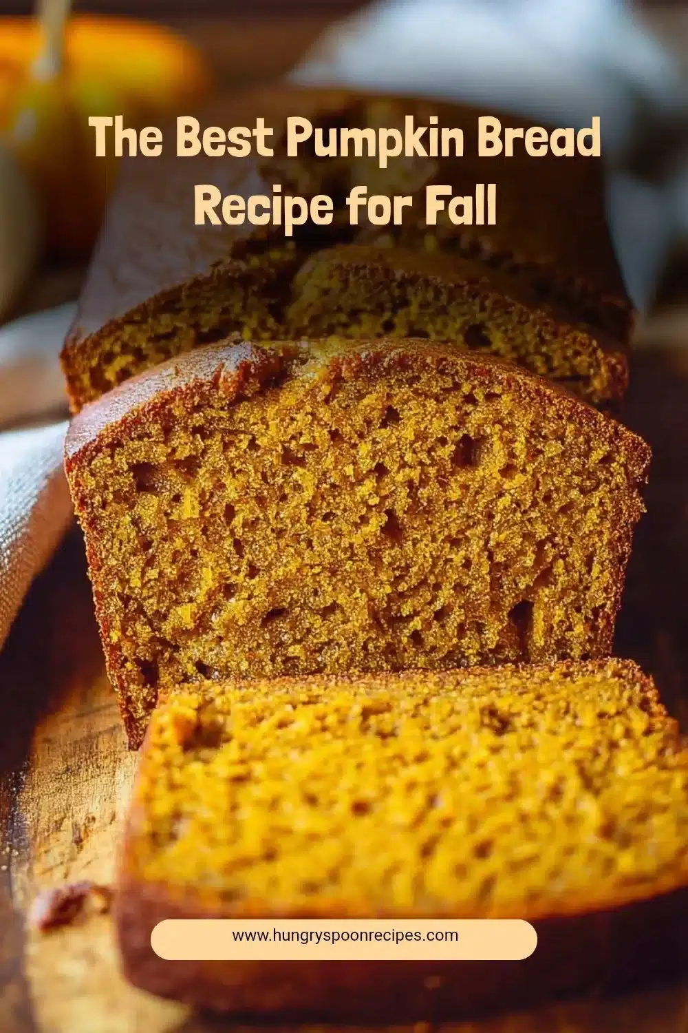 Loaf of homemade pumpkin bread with spices and walnuts, perfect for fall.