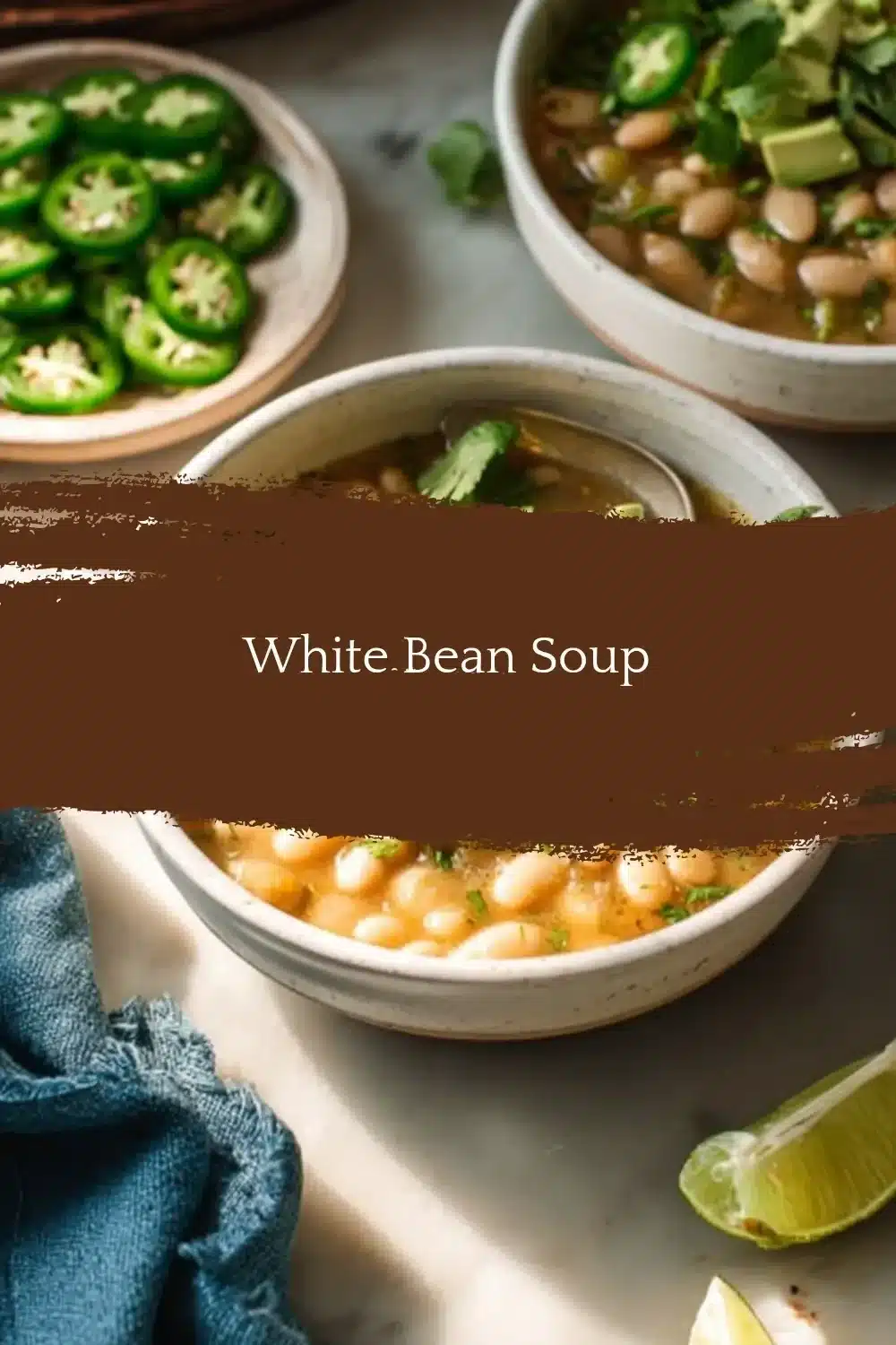 Bowl of hearty white bean soup garnished with herbs.