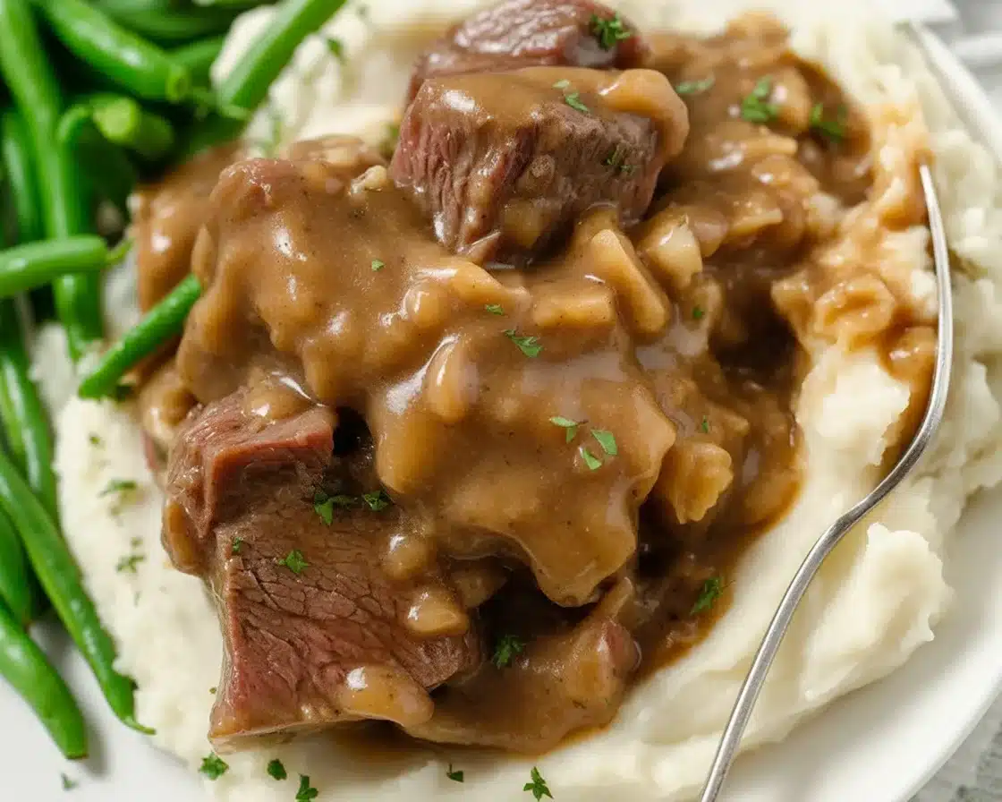 7 Flavorful Cubed Steak Recipes You'll Love to Try! 1 Tender cubed steak recipe with gravy and onions, perfect for quick dinners.