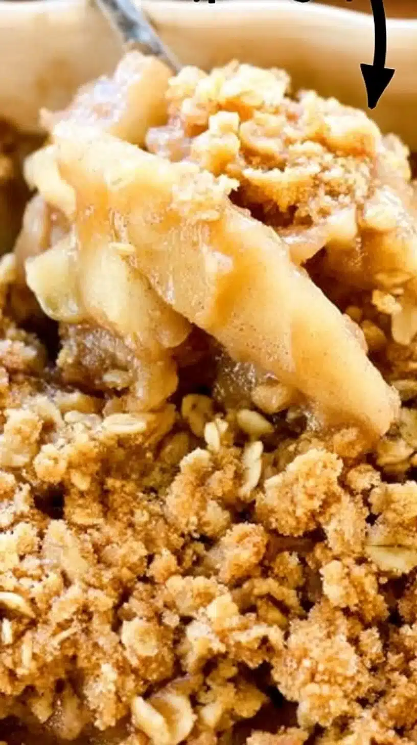 Amish Apple Crisp 1 Amish Apple Crisp dessert topped with a golden crumb topping and fresh apples.