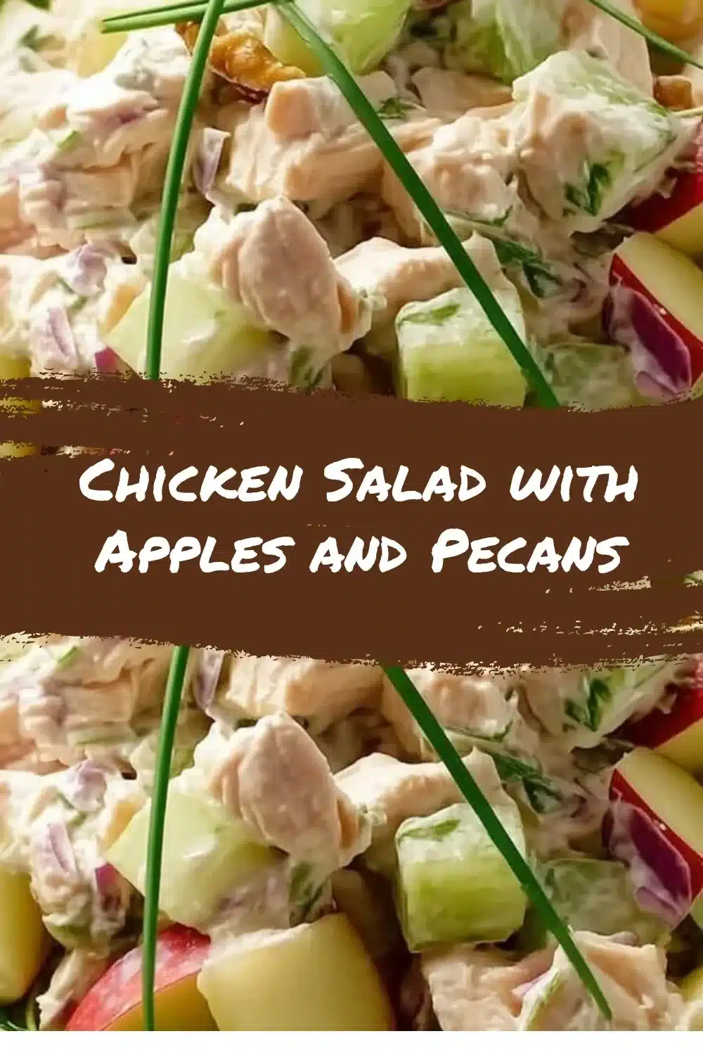 Chicken Salad with Apples and Pecans 1 Chicken salad with apples and pecans in a bowl, garnished with fresh herbs