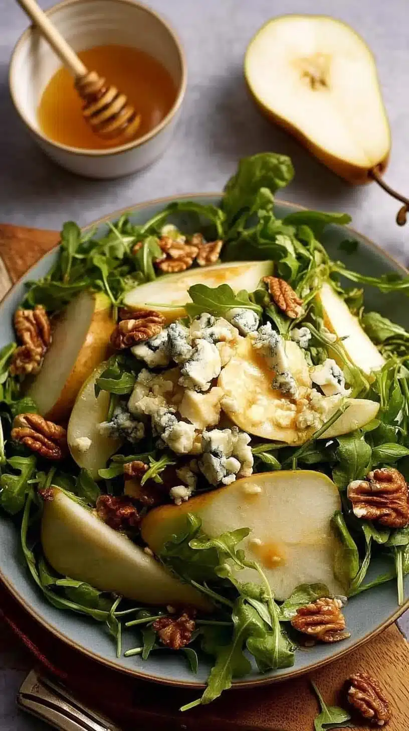 Delicious pear salad topped with blue cheese and rocket leaves.