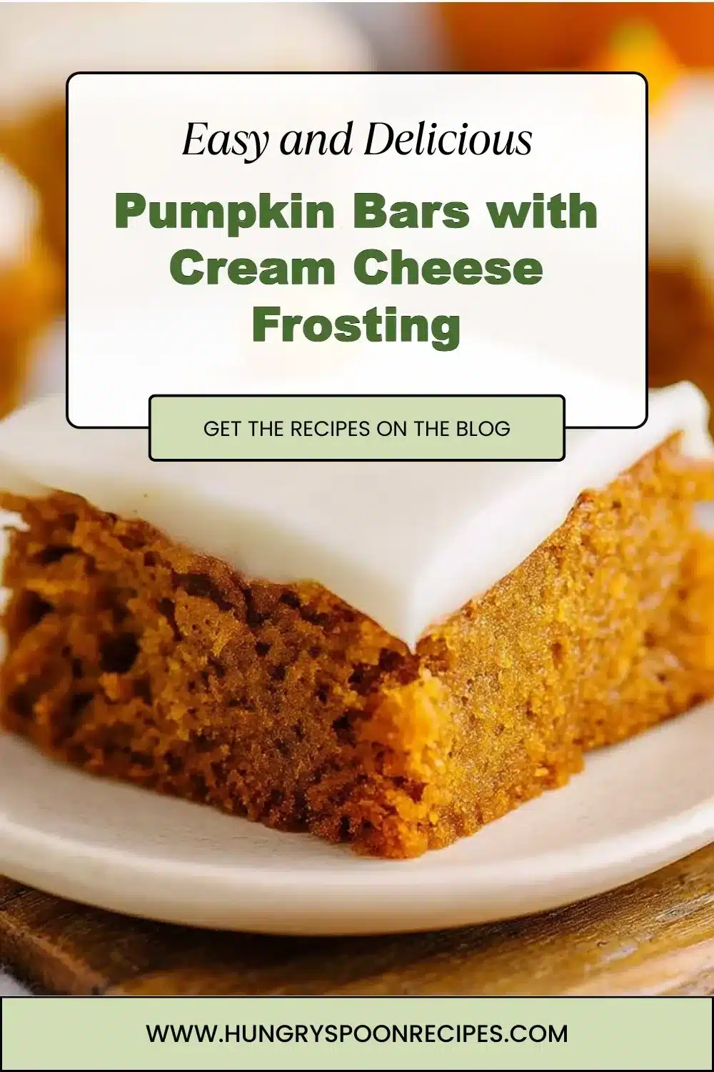 Pumpkin Bars with Cream Cheese Frosting 1 Pumpkin bars with cream cheese frosting on a white plate.