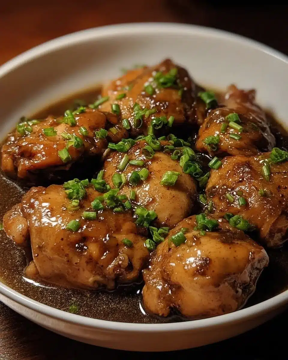 Easy Crockpot Chicken Adobo 1 Delicious easy Crockpot Chicken Adobo served with rice on a plate